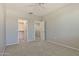 This bedroom features carpet flooring, neutral paint, and a walk-in closet at 14870 W Encanto Blvd # 1038, Goodyear, AZ 85395