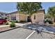 Exterior view of the neighborhood clubhouse with a red car in the parking lot at 14870 W Encanto Blvd # 1038, Goodyear, AZ 85395