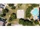 Aerial view showcasing community amenities: basketball court, pool, and green spaces for recreation and relaxation at 14870 W Encanto Blvd # 1038, Goodyear, AZ 85395