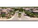 Inviting community entrance featuring lush landscaping, decorative signage, and well-maintained streets in a desirable neighborhood at 14870 W Encanto Blvd # 1038, Goodyear, AZ 85395
