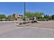 Community entrance sign amidst well-maintained landscaping and attractive brickwork at 14870 W Encanto Blvd # 1038, Goodyear, AZ 85395