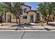 Charming two-story home featuring neutral stucco, a gated entry, and drought-tolerant landscaping at 14870 W Encanto Blvd # 1038, Goodyear, AZ 85395