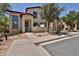 Inviting two-story home featuring neutral stucco, a gated entry, and low-maintenance desert landscaping at 14870 W Encanto Blvd # 1038, Goodyear, AZ 85395