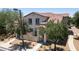 Charming two-story home featuring stucco siding, tiled roof, and a quaint gated front patio at 14870 W Encanto Blvd # 1038, Goodyear, AZ 85395