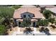 Charming home exterior featuring a tile roof, desert landscaping, and a welcoming entrance with dual doorways at 14870 W Encanto Blvd # 1038, Goodyear, AZ 85395