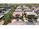 Aerial view showcasing a home with a tile roof and mature trees in a well-maintained neighborhood at 14870 W Encanto Blvd # 1038, Goodyear, AZ 85395