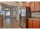Bright kitchen view showcasing stainless steel refrigerator and dining area at 14870 W Encanto Blvd # 1038, Goodyear, AZ 85395