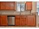 Traditional kitchen with wood cabinets, stainless steel appliances, and granite countertops at 14870 W Encanto Blvd # 1038, Goodyear, AZ 85395