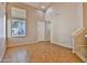 Bright living room with high ceilings, tile flooring, and a view to the outside at 14870 W Encanto Blvd # 1038, Goodyear, AZ 85395