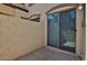 Concrete back patio with sliding glass door at 14870 W Encanto Blvd # 1038, Goodyear, AZ 85395