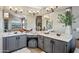 Well-lit bathroom with dual sinks, vanity area, and stylish decor at 15411 S 13Th Ave, Phoenix, AZ 85045