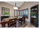 Traditional dining room featuring wood table, shutters, and charming built-in cabinet at 15411 S 13Th Ave, Phoenix, AZ 85045