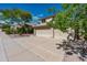 Well-maintained two-story home featuring a three-car garage and manicured landscaping at 15411 S 13Th Ave, Phoenix, AZ 85045