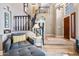 Inviting foyer featuring a staircase, comfortable seating area, and elegant decor at 15411 S 13Th Ave, Phoenix, AZ 85045