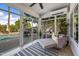 Comfortable sunroom featuring tile floor, lots of windows, and a cozy chaise lounge at 15411 S 13Th Ave, Phoenix, AZ 85045