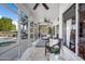 Bright and airy sunroom with tile flooring, multiple windows, and comfortable seating at 15411 S 13Th Ave, Phoenix, AZ 85045