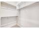 Walk-in closet with shelves and railing at 17308 W Royal Palm Rd, Waddell, AZ 85355