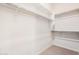 Walk-in closet with shelves and railing at 17308 W Royal Palm Rd, Waddell, AZ 85355