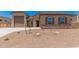 Charming single-story home with stone accents, desert landscaping, and a spacious three-car garage at 17308 W Royal Palm Rd, Waddell, AZ 85355