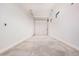 Spacious garage with a new garage door, white trim, and clean concrete floor at 17308 W Royal Palm Rd, Waddell, AZ 85355