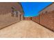 A large side yard, offering ample space and featuring a decorative gate at 17308 W Royal Palm Rd, Waddell, AZ 85355