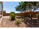 Backyard featuring desert landscaping and privacy fence offering a peaceful space at 19751 W Adams St, Buckeye, AZ 85326
