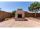 Backyard with brick patio featuring a fireplace offering a relaxing space at 19751 W Adams St, Buckeye, AZ 85326