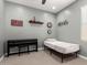 The cozy bedroom features soft colors, a simple bed, keyboard, and wall decor at 19751 W Adams St, Buckeye, AZ 85326
