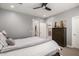 Comfortable bedroom features neutral walls, ceiling fan, and dresser with decor at 19751 W Adams St, Buckeye, AZ 85326