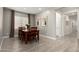 Dining room with a wooden table set, neutral colors, and tile floors at 19751 W Adams St, Buckeye, AZ 85326