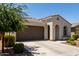 Beautiful single-story home with a two-car garage and desert-friendly landscaping at 19751 W Adams St, Buckeye, AZ 85326