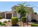 Single-story home with a desert landscaped front yard and neutral stucco exterior at 19751 W Adams St, Buckeye, AZ 85326