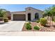 Charming single-story home with a well-maintained front yard and two-car garage at 19751 W Adams St, Buckeye, AZ 85326