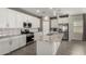 Well-equipped kitchen with granite counters, stainless appliances, and a kitchen island at 19751 W Adams St, Buckeye, AZ 85326