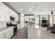 Modern kitchen with stainless steel appliances, granite countertops, and white cabinets at 19751 W Adams St, Buckeye, AZ 85326
