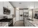 Modern kitchen featuring white cabinets, granite countertops, and stainless steel appliances at 19751 W Adams St, Buckeye, AZ 85326