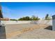 Large backyard with blue skies is ready for customization and landscaping at 2036 W Windrose Dr, Phoenix, AZ 85029
