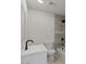Modern bathroom features updated tiling, black fixtures, shower and tub combo at 2036 W Windrose Dr, Phoenix, AZ 85029