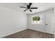 Bright bedroom features wood look floors, fan, and a window providing natural light at 2036 W Windrose Dr, Phoenix, AZ 85029