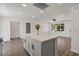 Open concept kitchen showcases an island, modern floors, recessed lighting, and views to the living area at 2036 W Windrose Dr, Phoenix, AZ 85029