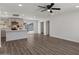 Open-concept living room and kitchen area with stainless appliances, island seating and outdoor access at 2036 W Windrose Dr, Phoenix, AZ 85029