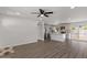 Open-concept living room and kitchen featuring wood flooring, recessed lighting and lots of natural light at 2036 W Windrose Dr, Phoenix, AZ 85029