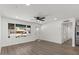 Open-concept living room showcasing wood flooring, large window, and recessed lighting throughout at 2036 W Windrose Dr, Phoenix, AZ 85029