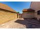 Low-maintenance backyard with rock landscaping, shed, and privacy walls at 2050 W Nido Ave, Mesa, AZ 85202
