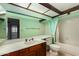 A bathroom featuring a vanity, toilet, and shower with a mint-colored shower curtain at 2050 W Nido Ave, Mesa, AZ 85202