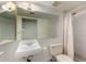 Bathroom with a sink, toilet, shower and a large vanity mirror at 2050 W Nido Ave, Mesa, AZ 85202