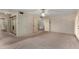 Spacious bedroom with floral wallpaper, closet, ceiling fan, and a doorway to the bathroom at 2050 W Nido Ave, Mesa, AZ 85202