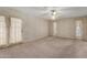 Large bedroom with floral wallpaper, ceiling fan and a private outdoor entry at 2050 W Nido Ave, Mesa, AZ 85202