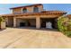 A two car garage with red tile roof, and low maintenance landscaping at 2050 W Nido Ave, Mesa, AZ 85202
