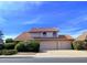 Charming two-story home with a tile roof, arched windows, and a well-manicured lawn at 2050 W Nido Ave, Mesa, AZ 85202
